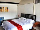 фото отеля Lijiang Free Cloud Guesthouse