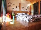 фото отеля Blue Skies Inn - Lijiang