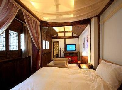фото отеля Lijiang Lize Graceland Artistic Suite Inn