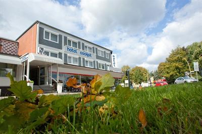 фото отеля Hotel Schuemann Garni am Airport