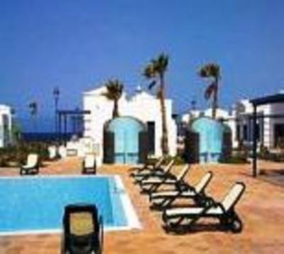 фото отеля Coral Beach Bungalows