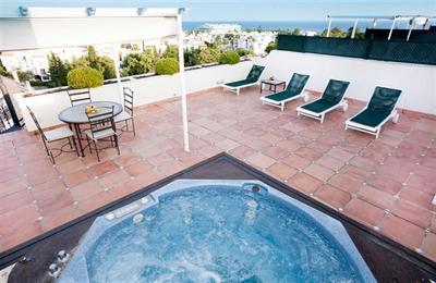 фото отеля Apartamentos Guadalpin Boutique