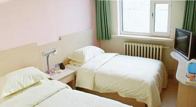 фото отеля Yuejia Business Hotel Hohhot Xuefu Garden