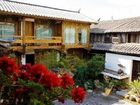 фото отеля Zhongyi Inn Lijiang Xiangshuyuan Courtyard Hotel