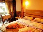 фото отеля Zhongyi Inn Lijiang Xiangshuyuan Courtyard Hotel