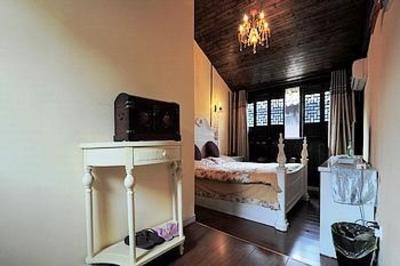 фото отеля Zhuanjiaoai Inn