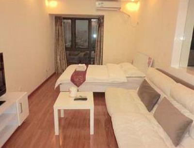 фото отеля Shengang Apartment Hotel Yuhedi