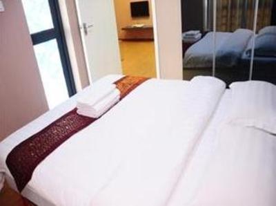 фото отеля Shengang Apartment Hotel Yuhedi