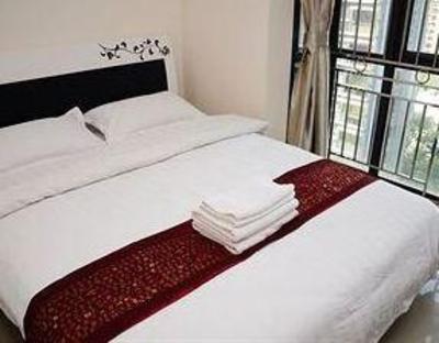 фото отеля Shengang Apartment Hotel Yuhedi