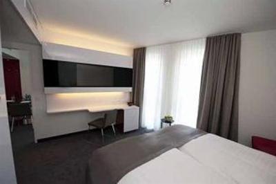 фото отеля Dormero Hotel Frankfurt Messe