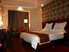 фото отеля Green Tree Inn Jiuquan Century Plaza Hotel