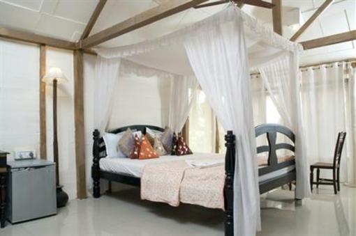 фото отеля Leela Cottages