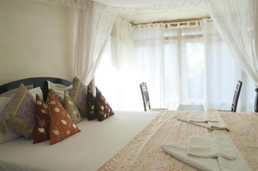 фото отеля Leela Cottages