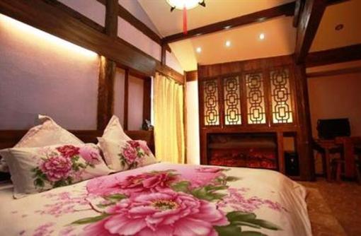 фото отеля Lijiang Na Yunqi Valley Inn
