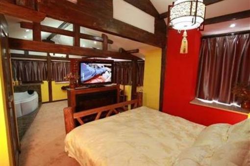 фото отеля Lijiang Na Yunqi Valley Inn