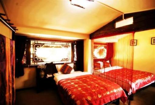 фото отеля Xingfu Inn Lijiang
