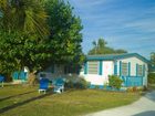 фото отеля Tropical Winds Motel & Cottages