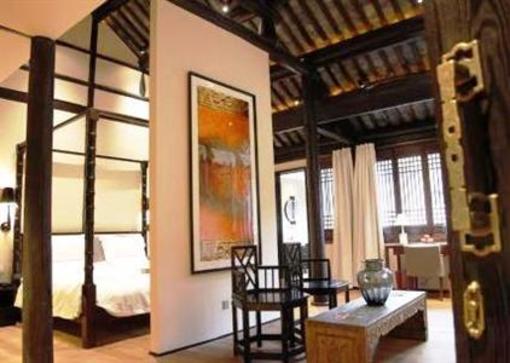 фото отеля Blossom Hill Inn Zhouzhuang Seasonland