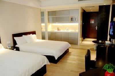 фото отеля Binjiang Kending Serviced Apartment Hotel