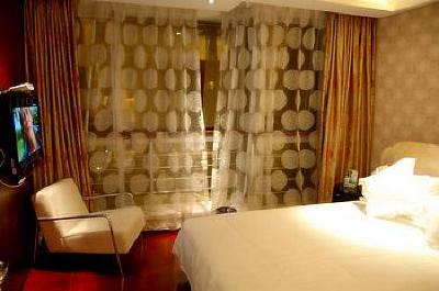 фото отеля Binjiang Kending Serviced Apartment Hotel