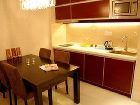 фото отеля Binjiang Kending Serviced Apartment Hotel