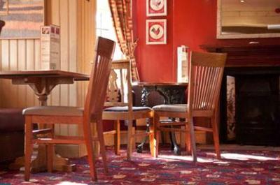 фото отеля Black Lion Harvester & Innkeeper's Lodge