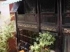 фото отеля Lijiang Liuliu Inn by Wind Station