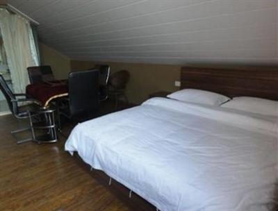 фото отеля Lizhuang Guyun Holiday Hostel