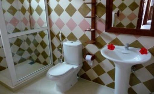 фото отеля Mnarani Beach Cottages