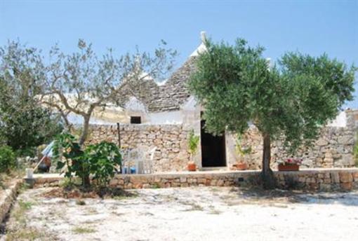 фото отеля Trullo Del Melograno Bed and Breakfast Castellana Grotte