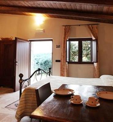 фото отеля Trullo Del Melograno Bed and Breakfast Castellana Grotte