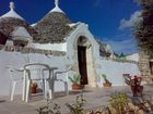 фото отеля Trullo Del Melograno Bed and Breakfast Castellana Grotte