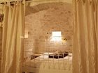 фото отеля Trullo Del Melograno Bed and Breakfast Castellana Grotte