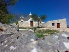 фото отеля Trullo Del Melograno Bed and Breakfast Castellana Grotte