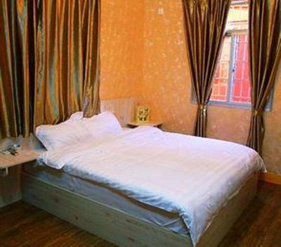фото отеля Woxingwosu Hongqiang Inn