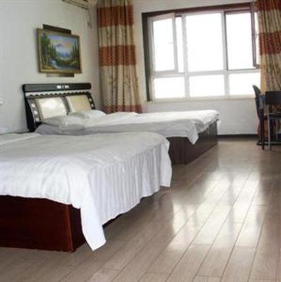 фото отеля Dalian Sea View Deluxe Apartment