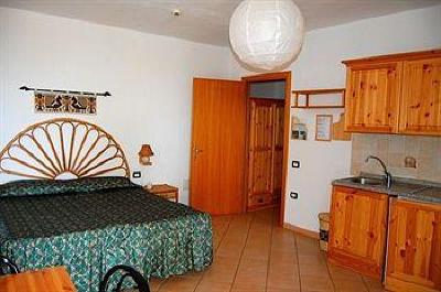 фото отеля Aparthotel Domus De Janas Sul Mare