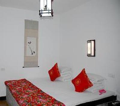 фото отеля Qingxinyuan Folk Hotel